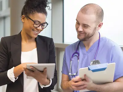 Health care professionals looking at health data.