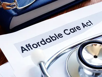 A collection of paperwork with the heading "Affordable Care Act" and a stethoscope.