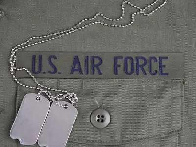 Closeup of an Air Force uniform with dog tags.