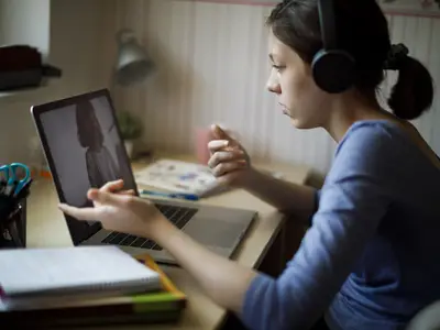 Teacher and coach talking over videocall