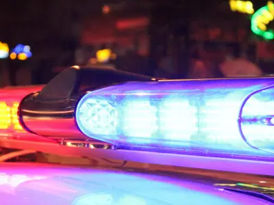 Police lights flashing at night