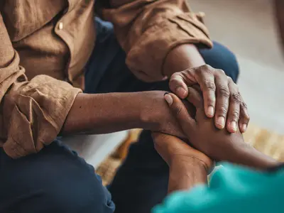 People clasping hands