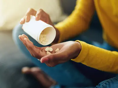 Person holding prescription bottle