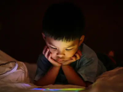 Boy looks at screen