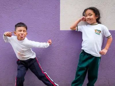 Young children pose for camera