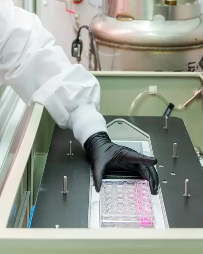 Photo of an RTI scientist working in a lab.