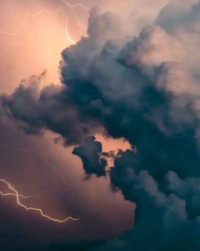 Lightning and clouds in a dark sky