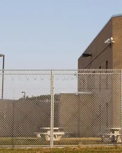 Fence with prison building