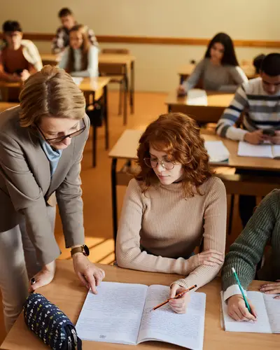 Photo of teacher and students in a classroom