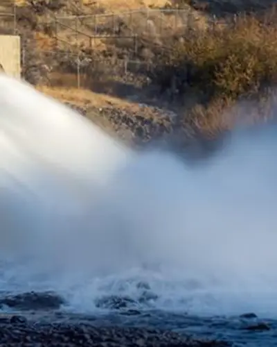 Flood water coming out of large drainage system