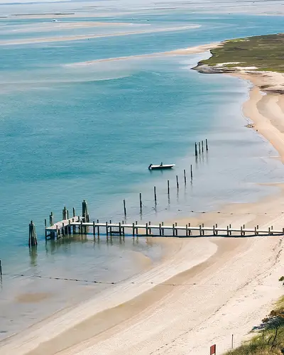 OBX, NC coastline. Blue water with shore and dock
