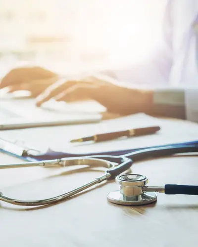 Doctor working on laptop
