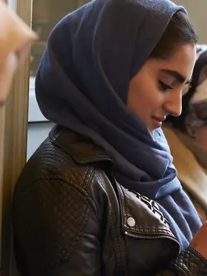 A group of young women using mobile phones