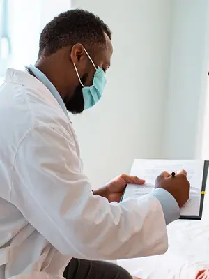 doctor takes time to explain treatment to his patient