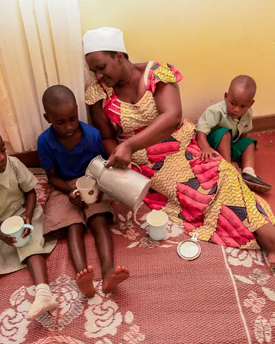 Angelica Mukayizere is a Milk Collection Manager for Green Foods, a USAID supported agribusiness in Rwanda that produces dairy products for retail sale. Angelica supports her family of two children using money from her job.