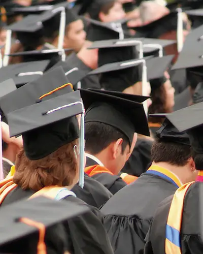Students in caps and gowns at a graduation ceremony