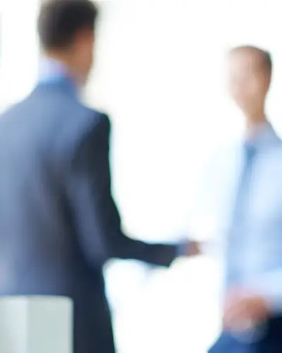 Blurry image of partners in a building