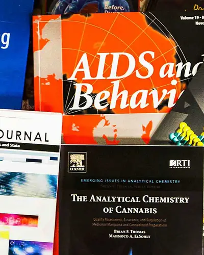 assortment of academic journals, books, and scholarly publicattions