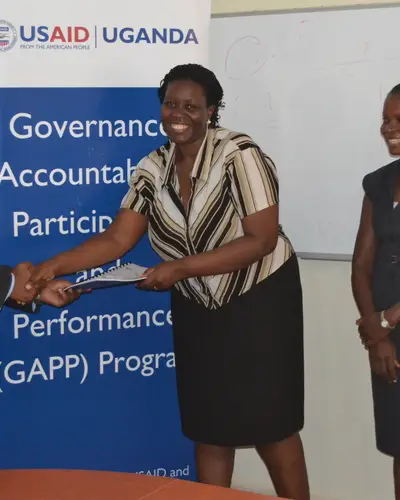 Eva Matsiko Awarding Grant to Centre for Governance and Economic Development