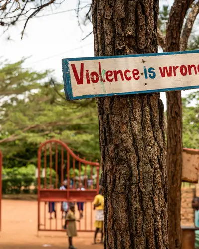 A sign at a Ugandan school participating in the Journeys program promotes nonviolence.