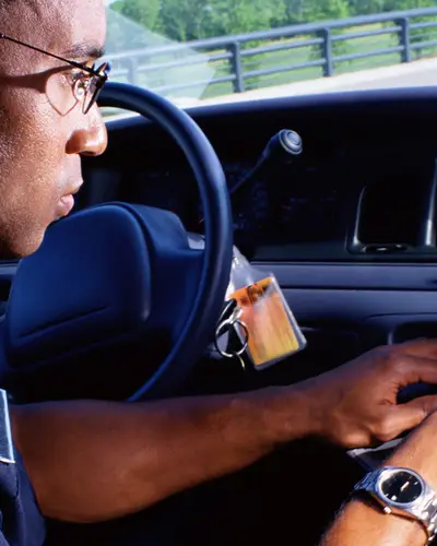 Police officer access information via a laptop computer in his squad car