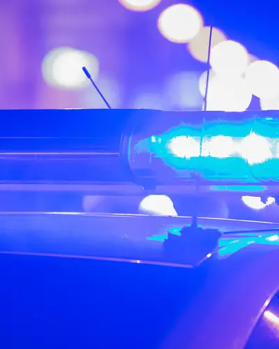 police car lights flashing at night