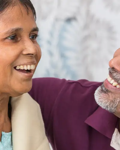 Two people embrace