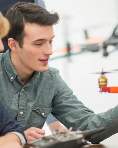 Innovators work on a drone prototype