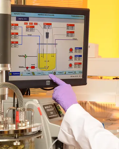 Woman using anaerobic bioreactor equipment