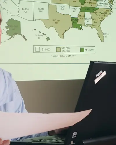 Policy analyst performing data analysis