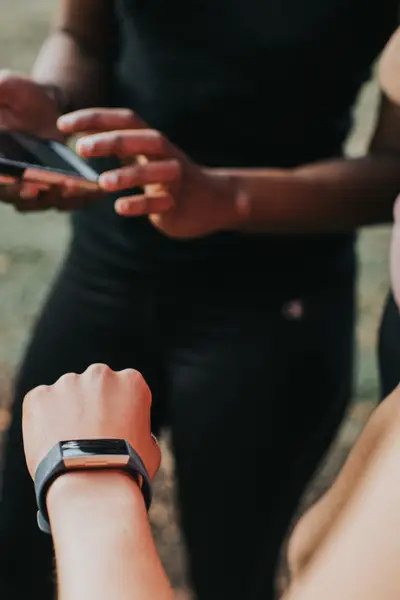 Person checking wearable watch
