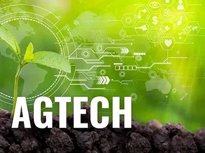 Green graphic with brown dirt and the phrase "AGTECH" printed in white