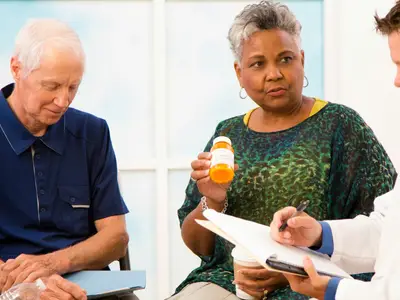 A doctor discusses prescription drug abuse with a patient and family members.