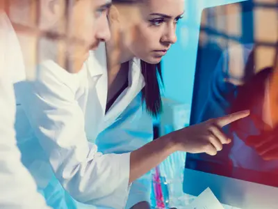 doctors looking at a computer screen
