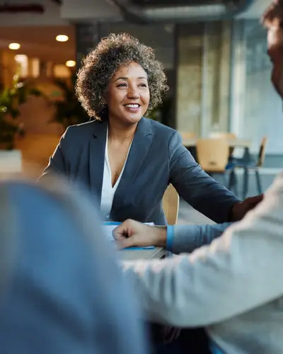 Group positively conversing in a workplace environment