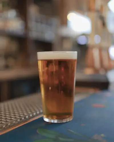 Full glass of beer on countertop