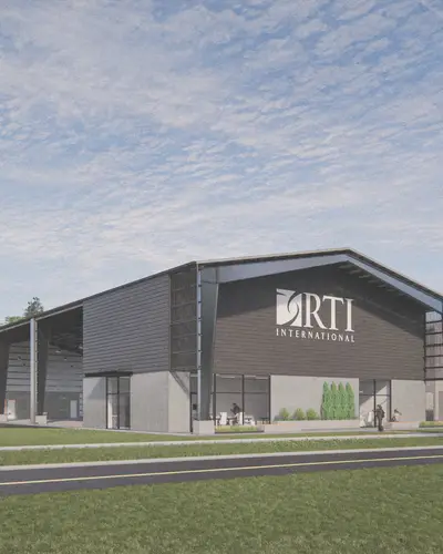 Graphic of new RTI Pilot Xcelerator. Building with offices and open garage space
