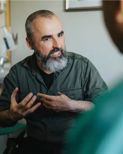 Man speaks with health care professional