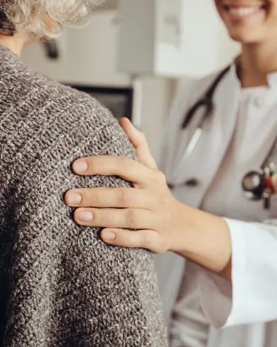 Doctor comforts patient
