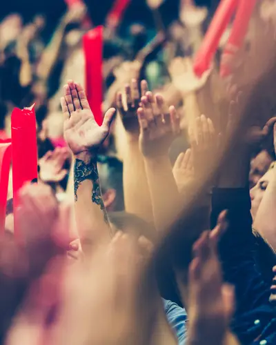 hands clapping in a stadium