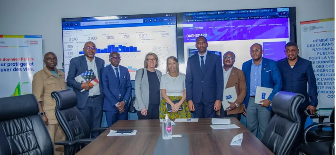People gathered around a table in a conference room