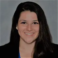 Headshot of Allyson Corbo smiling against a grey background