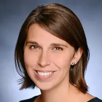 Headshot of Heather Danysh smiling against a blue background