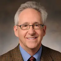Headshot of Derick W. Brinkerhoff