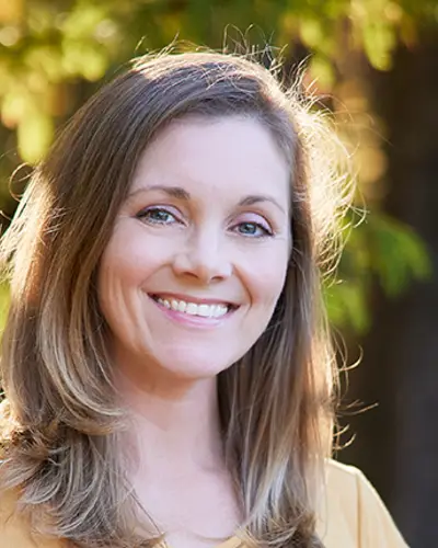 Headshot of Kristen Stolka, showing her smiling outdoors