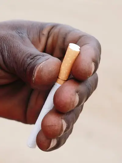 hand holding cigarette