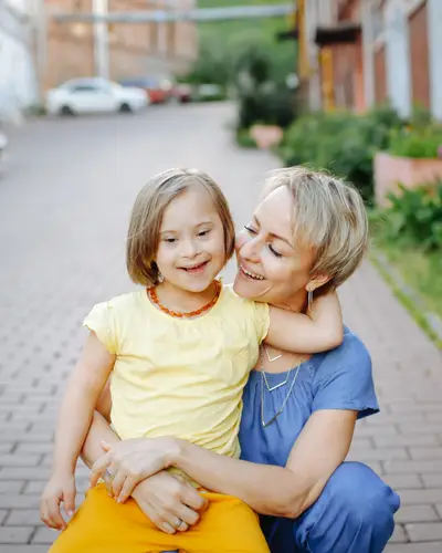 Mother embraces daughter