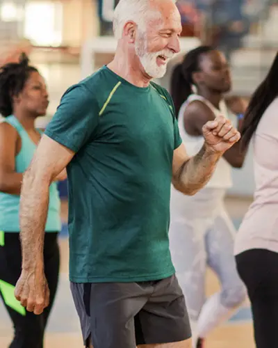 A group of people participate in a community fitness class.