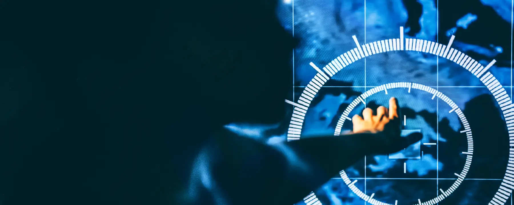 Image of military member looking at a map on a screen.