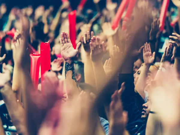 hands clapping in a stadium